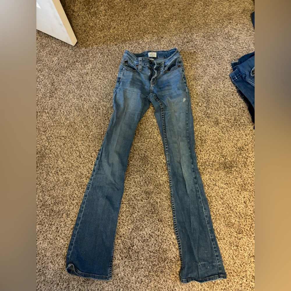 Pants have a little white stain on the front below the pocket.